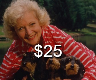 Betty White with 3 puppies
