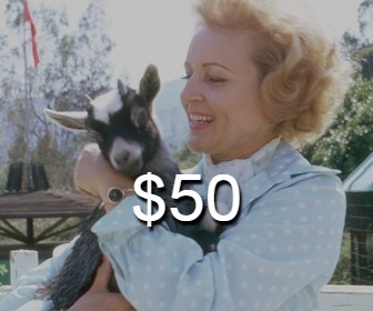 Betty White with a baby goat